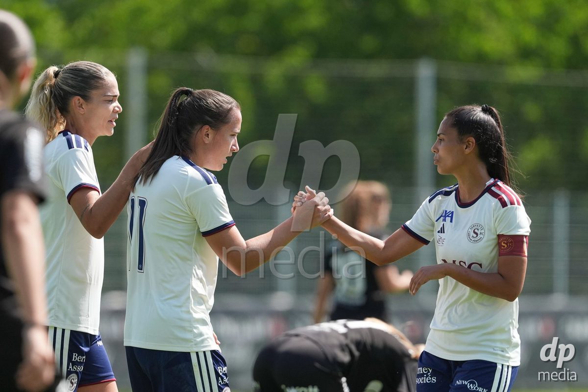 Crans-Montana, Switzerland - July 25: Daina Bourma (3 SFCCF) celebrates with Magdalena Izabela Sobal (11 SFCCF) after a goal during the AXA Women's Super League match between Servette FC Chenois Feminin and FC Sion Feminin at Stade du Christ-Roi on July 25, 2026 in Crans-Montana, Switzerland.
