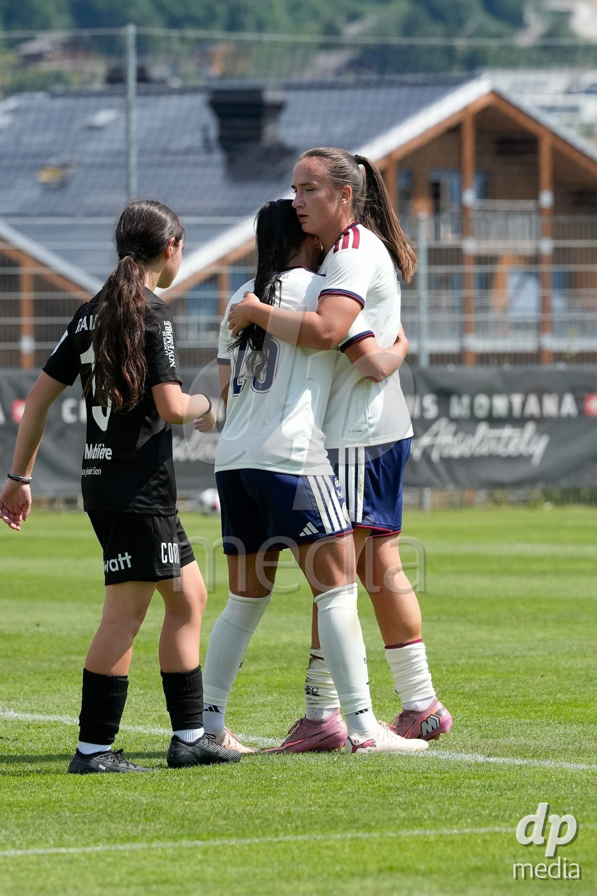 Crans-Montana, Switzerland - July 25: Magdalena Izabela Sobal (11 SFCCF) celebrates with Terchoun Meriame (25 SFCCF) during the AXA Women's Super League match between Servette FC Chenois Feminin and FC Sion Feminin at Stade du Christ-Roi on July 25, 2026 in Crans-Montana, Switzerland.