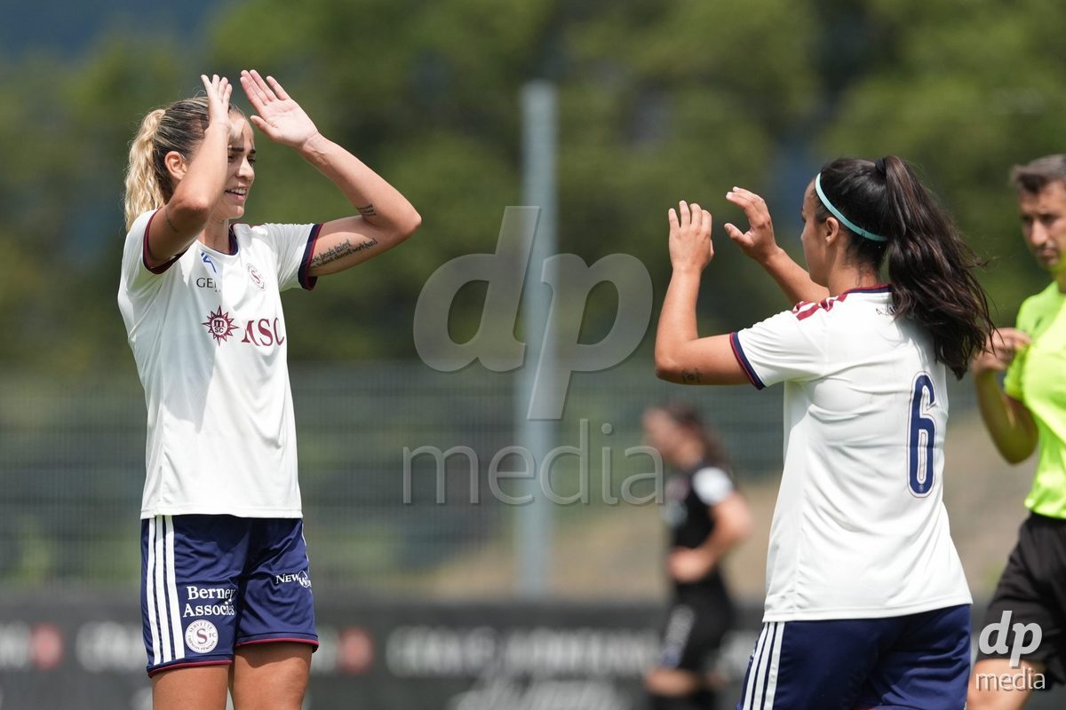 Crans-Montana, Switzerland - July 25: De al m da Eira Stefanie (64 SFCCF) celebrates the goal of Hernandez Diaz Paola (6 SFCCF) with her during the AXA Women's Super League match between Servette FC Chenois Feminin and FC Sion Feminin at Stade du Christ-Roi on July 25, 2026 in Crans-Montana, Switzerland.