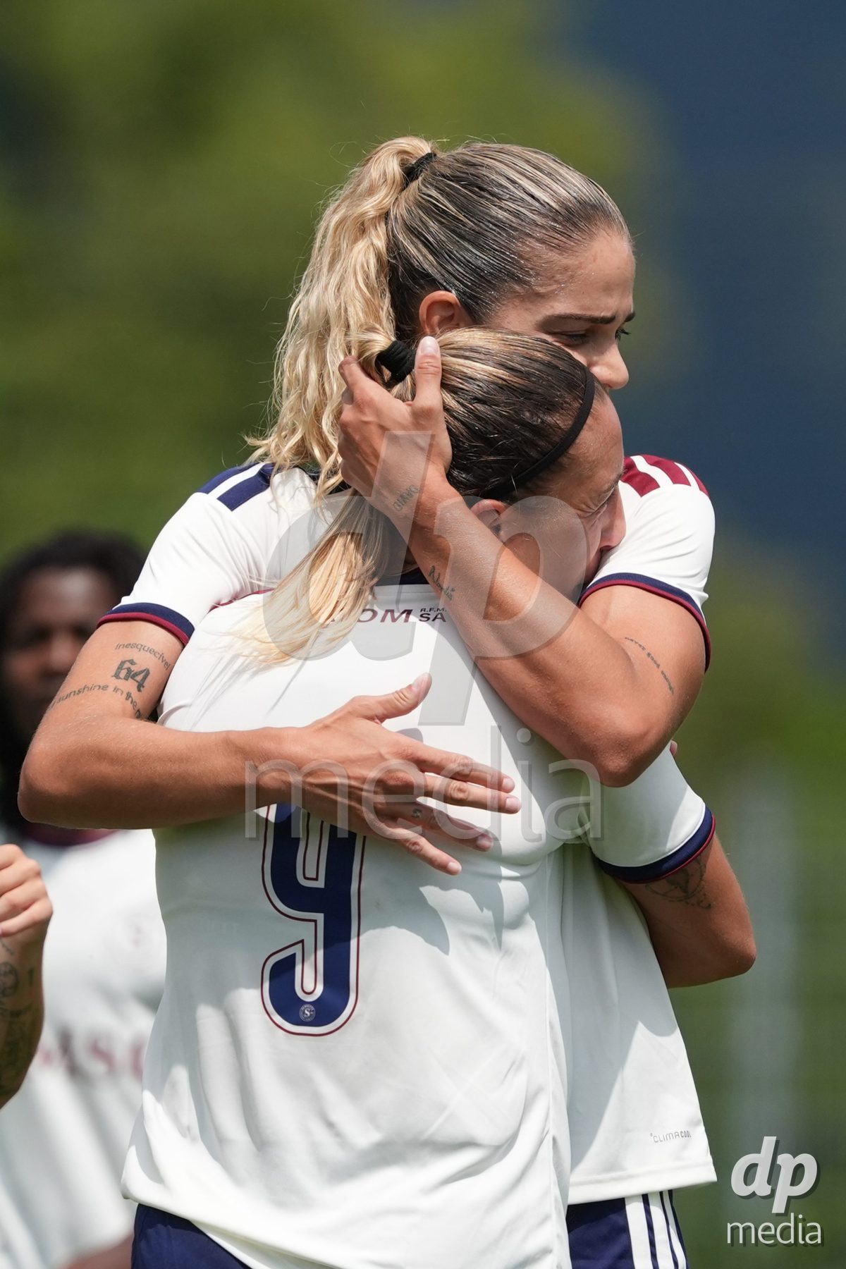 Crans-Montana, Switzerland - July 25: De al m da Eira Stefanie (64 SFCCF) celebrates with Gloria Marinelli (9 SFCCF) during the AXA Women's Super League match between Servette FC Chenois Feminin and FC Sion Feminin at Stade du Christ-Roi on July 25, 2026 in Crans-Montana, Switzerland.