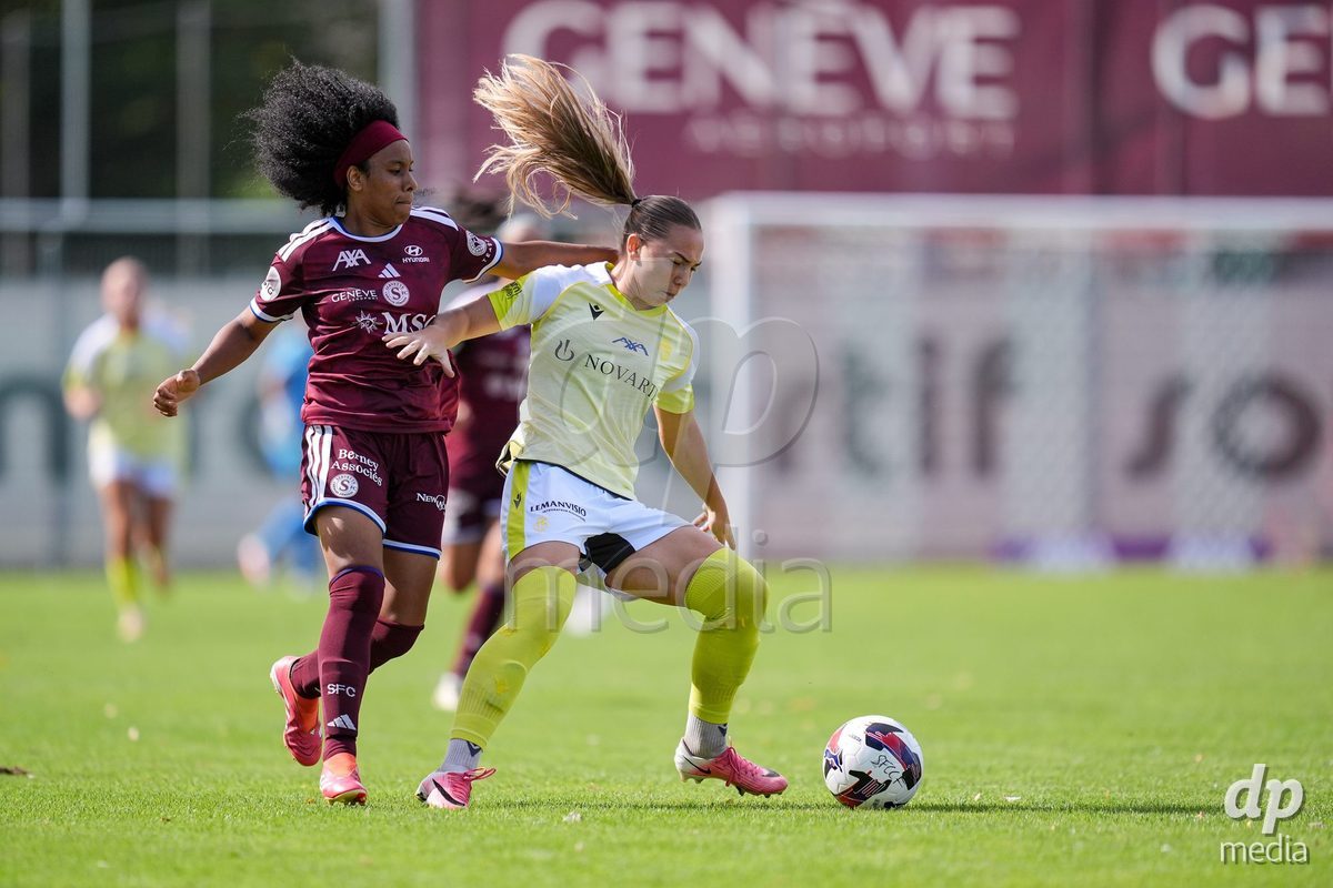 Geneva, Switzerland - August 29: Mickaella Francoise Halooa Cardia of Servette (L) and Krystyna Flis of FC Basel (R) battle for the ball (duel)  during the AXA Women's Super League match between Servette FC Chenois Feminin and FC Basel 1893 at Stade de Trois-Chene on August 29, 2026 in Geneva, Switzerland.