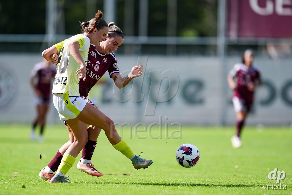 Geneva, Switzerland - August 29: Gloria Marinelli of Servette FC Chenois Feminin (R) and Mia Franziska Bennewitz of FC Basel (L) battle for the ball (duel) during the AXA Women's Super League match between Servette FC Chenois Feminin and FC Basel 1893 at Stade de Trois-Chene on August 29, 2026 in Geneva, Switzerland.