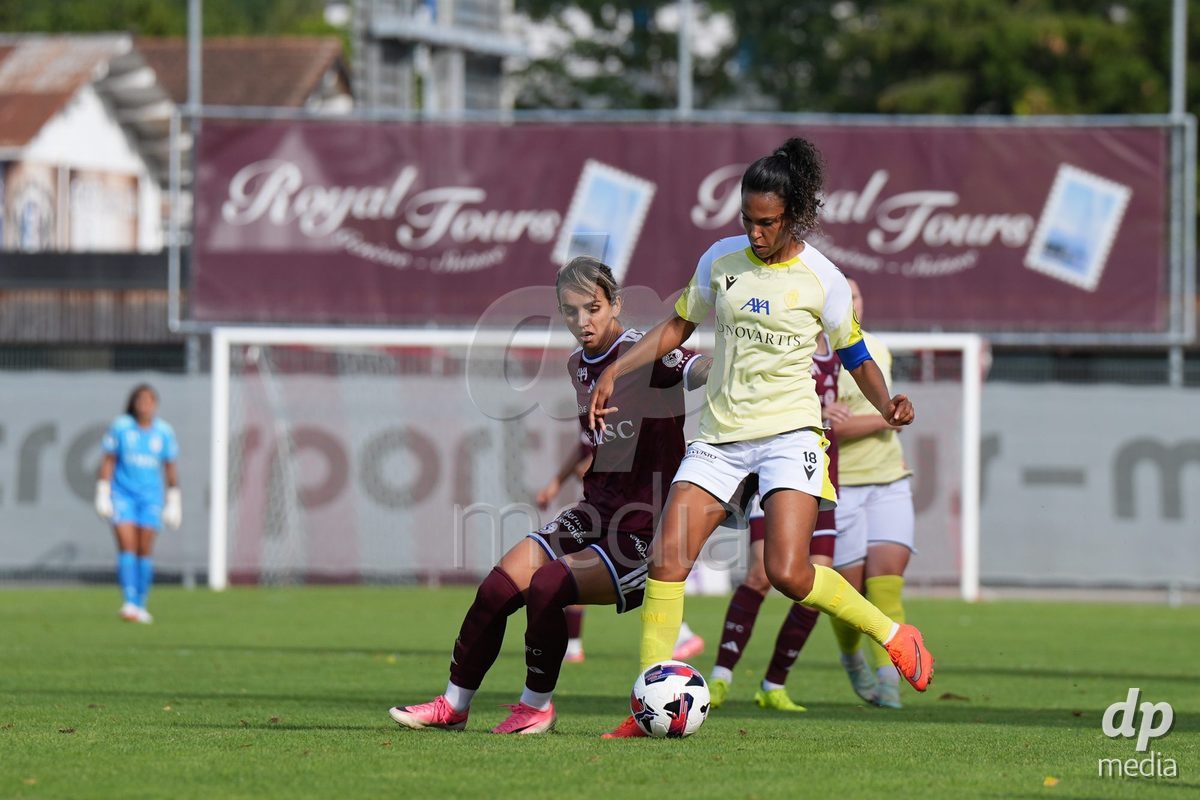Geneva, Switzerland - August 29: Natasha Andonova of Servette FC Chenois Feminin (L) and Coumba Louisa Sow of FC Basel (R) battle for the ball (duel) during the AXA Women's Super League match between Servette FC Chenois Feminin and FC Basel 1893 at Stade de Trois-Chene on August 29, 2026 in Geneva, Switzerland.