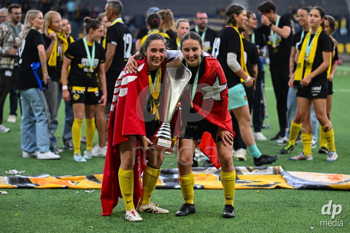 17/05/2025, Bern, Stadion Wankdorf, Women's Super League Final 2: BSC YB Frauen - GC Frauenfussball,  #19 Audrey Remy (BSC YB Frauen, left) and #13 Malaurie Granges (BSC YB Frauen, right) with the trophy