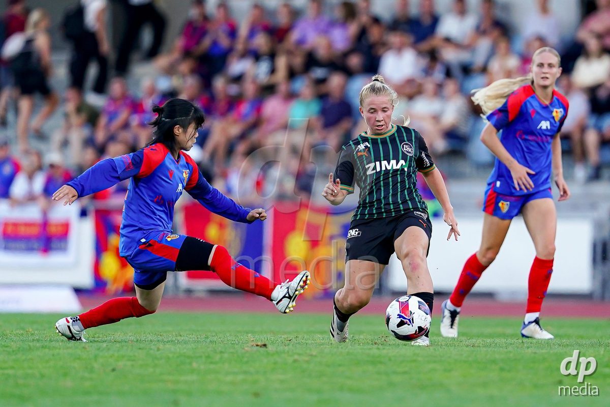 Basel, Switzerland - September 4: Tabea Griss of St. Gallen  1879 (R) and Mai Hirata of FC Basel 1893 (L) battle for the ball during the AXA Women's Super League match between FC Basel 1893 and FC St. Gallen 1879 at Leichtathletikstadion on September 4, 2026 in Basel, Switzerland.