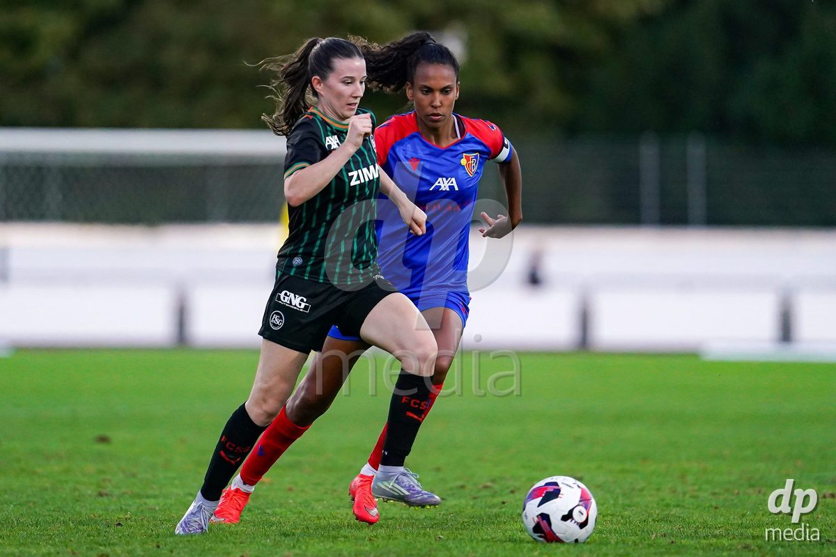 Basel, Switzerland - September 4: Coumba Sow of FC Basel 1893 (R) and Chantal Wyser of St.Gallen 1879 (L) battle for the ball during the AXA Women's Super League match between FC Basel 1893 and FC St. Gallen 1879 at Leichtathletikstadion on September 4, 2026 in Basel, Switzerland.