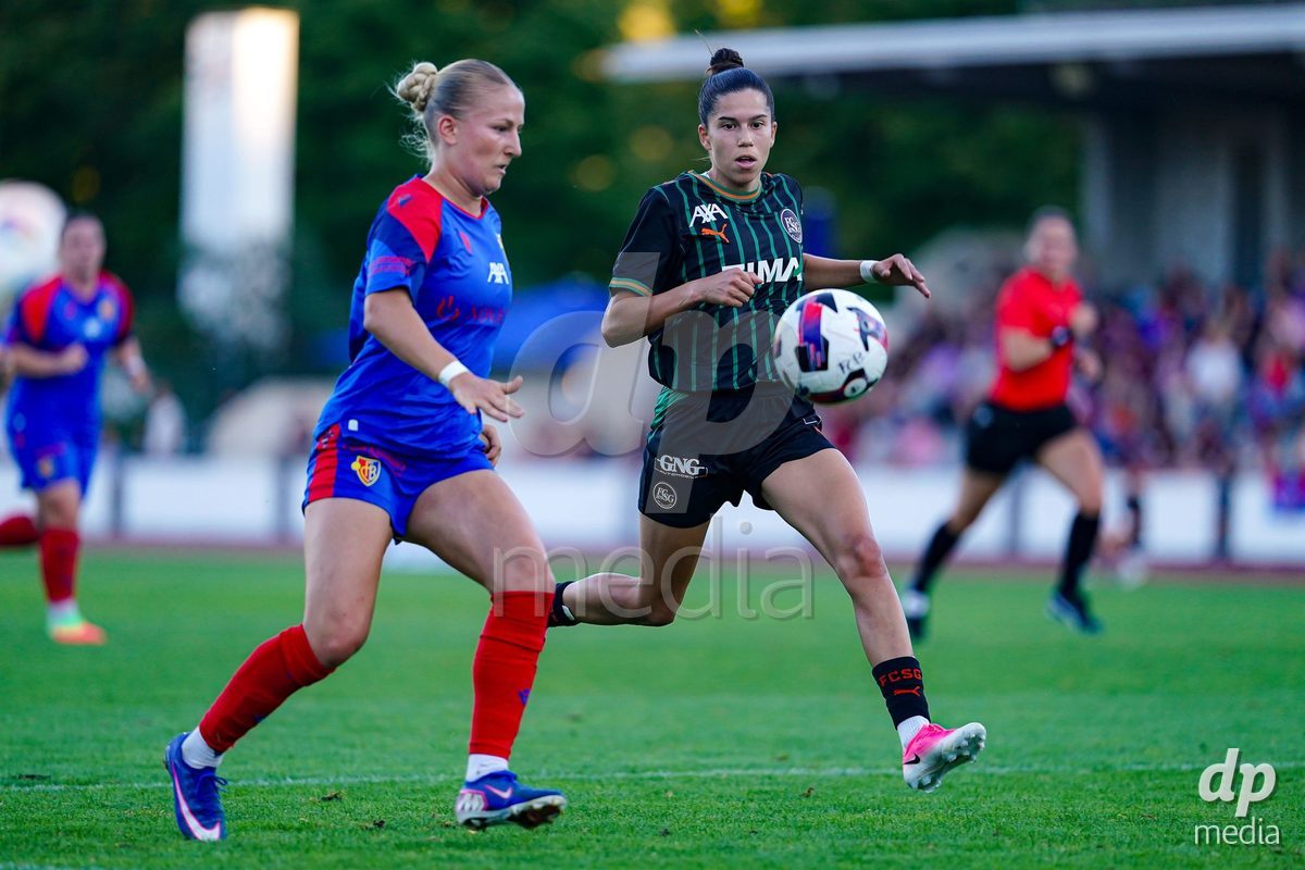 Basel, Switzerland - September 4: Julia Ruf of St.Gallen 1879 (R) and Fabia Reinschmidt of FC Basel 1893 (L) battle for the ball during the AXA Women's Super League match between FC Basel 1893 and FC St. Gallen 1879 at Leichtathletikstadion on September 4, 2026 in Basel, Switzerland.