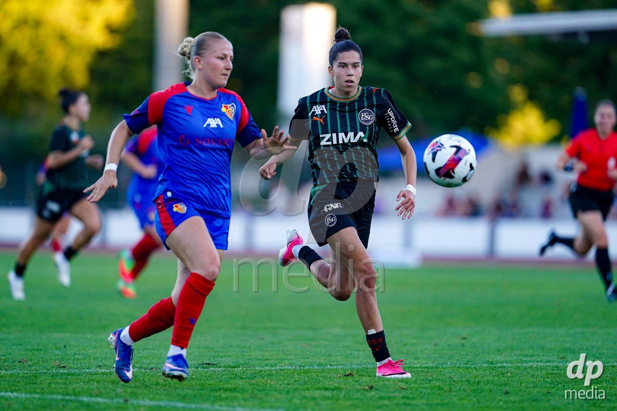 Basel, Switzerland - September 4: Julia Ruf of St.Gallen 1879 (R) and Fabia Reinschmidt of FC Basel 1893 (L) battle for the ball during the AXA Women's Super League match between FC Basel 1893 and FC St. Gallen 1879 at Leichtathletikstadion on September 4, 2026 in Basel, Switzerland.