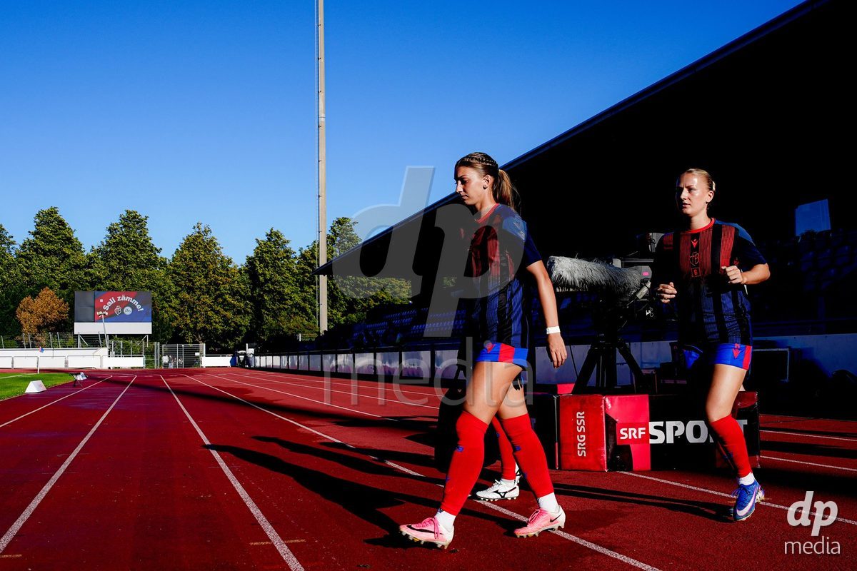Basel, Switzerland - September 4: Fabia Reinschmidt of FC Basel 1893 (R) and Alisa Arthur of FC Basel 1893 (L) preparing for warm during the AXA Women's Super League match between FC Basel 1893 and FC St. Gallen 1879 at Leichtathletikstadion on September 4, 2026 in Basel, Switzerland.