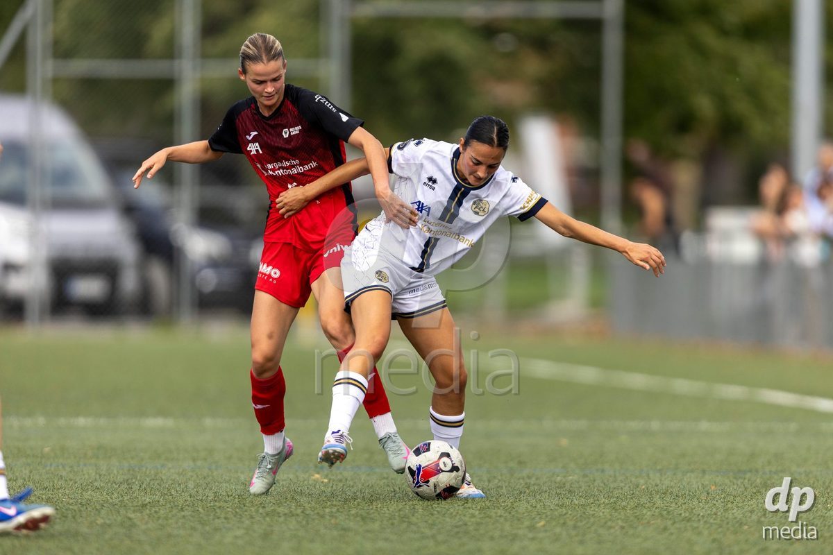 Aarau, Switzerland - September 5: XX during the AXA Women's Super League match between FC Aarau Frauen and FC Luzern at Sportanlage Schachen on September 5, 2026 in Aarau, Switzerland. Xenia Truninger of FC Aarau Frauen (L) fights for the ball with Athanasia Moraitou of FC Luzern Frauen (R)