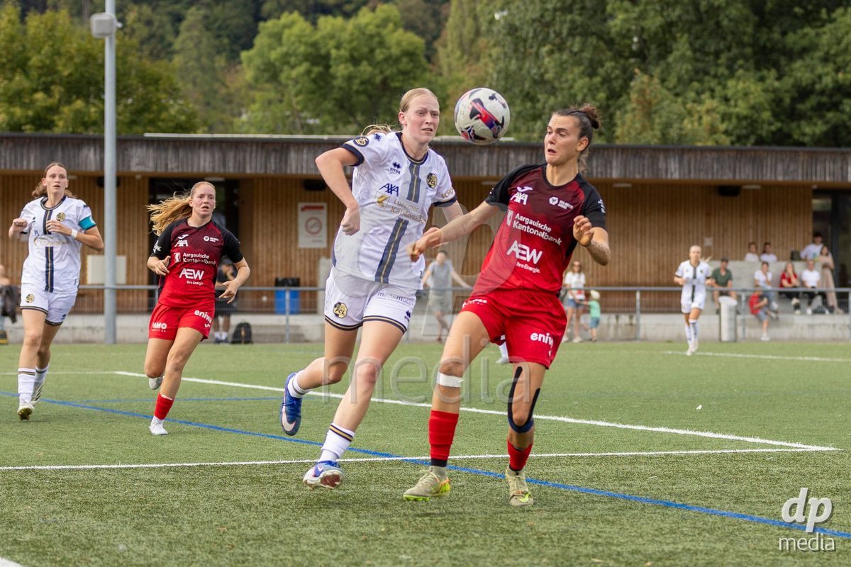 Aarau, Switzerland - September 5: Giulia Bison of FC Aarau Frauen (R) battles for the ball with Mara Arnold of FC Luzern Frauen (L) during the AXA Women's Super League match between FC Aarau Frauen and FC Luzern at Sportanlage Schachen on September 5, 2026 in Aarau, Switzerland.