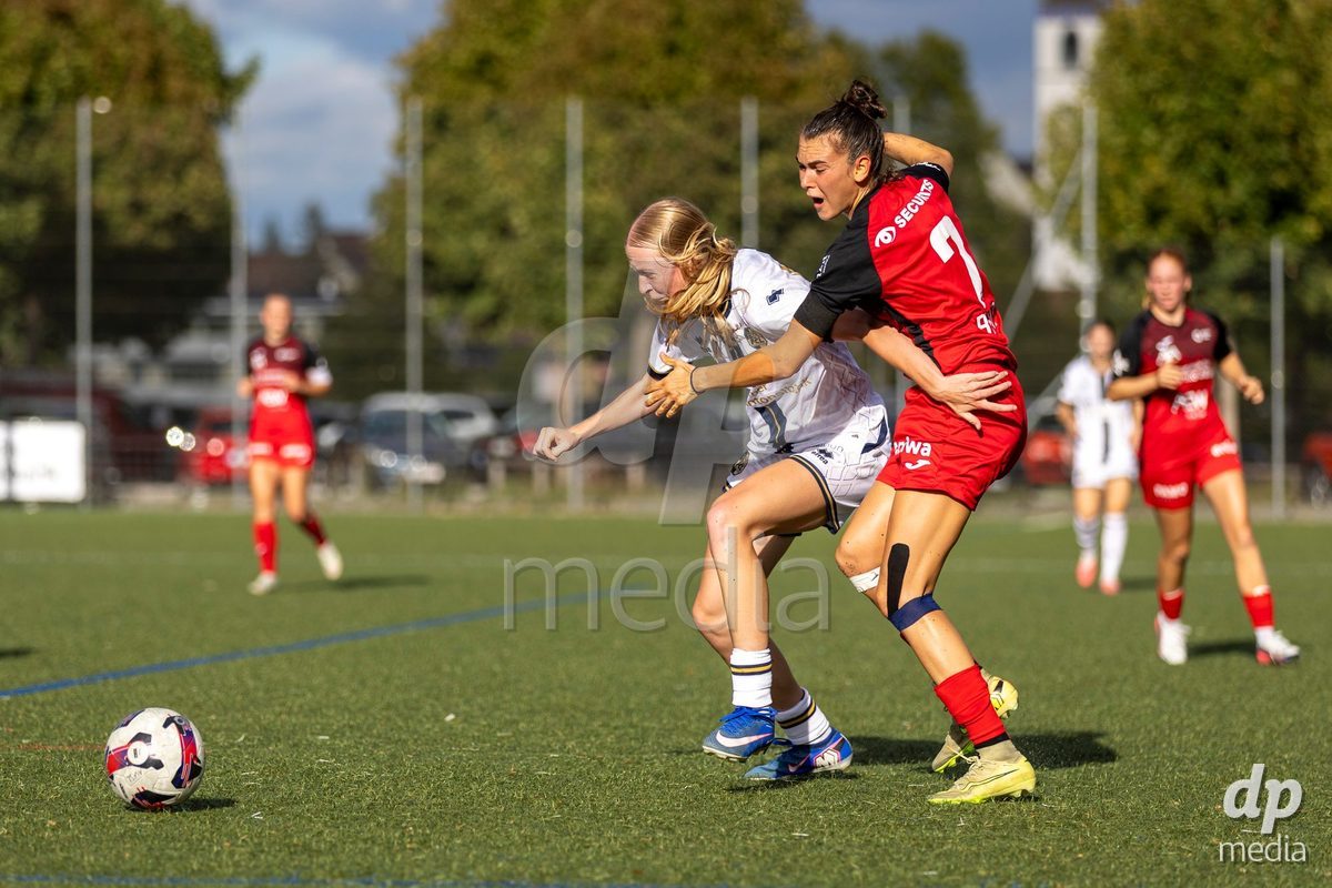 Aarau, Switzerland - September 5: Giulia Bison of FC Aarau Frauen (R) battles for the ball with with Mara Arnold of FC Luzern Frauen (L) during the AXA Women's Super League match between FC Aarau Frauen and FC Luzern at Sportanlage Schachen on September 5, 2026 in Aarau, Switzerland.