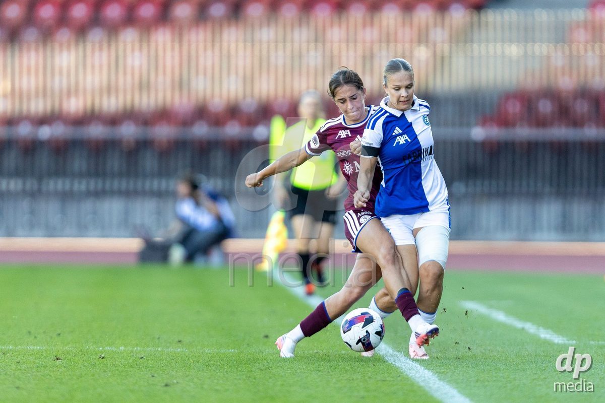 ZURICH, SWITZERLAND - September 6: Ella Ljustina of GC Frauenfussball (R) fights for the ball with Amina Muratovic (Amina MuratoviÄ) of Servette FC Chenois Feminin (L) during the AXA Women's Super League match between GC Frauenfussball and Servette FC Chenois Feminin at Letzigrund on September 6, 2026 in Zurich, Switzerland.