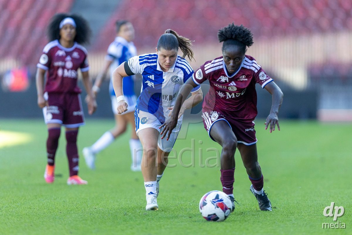 ZURICH, SWITZERLAND - September 6: Bénédicte Simon of Servette FC Chenois Feminin (R) controls the ball under pressure from Michelle Storni of GC Frauenfussball (L) during the AXA Women's Super League match between GC Frauenfussball and Servette FC Chenois Feminin at Letzigrund on September 6, 2026 in Zurich, Switzerland.