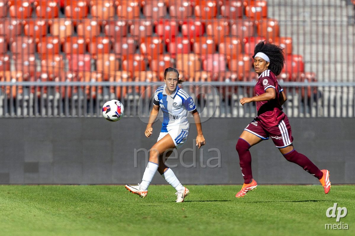 ZURICH, SWITZERLAND - September 6: Dalila Belen Ippolito of GC Frauenfussball (L) passes the ball under pressure from Mickaella Cardia (Mickaëlla Cardia) of Servette FC Chenois Feminin (R) during the AXA Women's Super League match between GC Frauenfussball and Servette FC Chenois Feminin at Letzigrund on September 6, 2026 in Zurich, Switzerland.