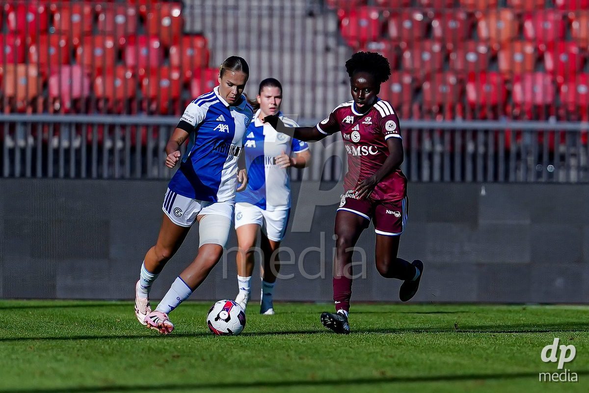 ZURICH, SWITZERLAND - September 6: Bénédicte Simon (Benedicte Simon) of Servette FC Chenois Feminin  (R) and Ella Ljustina of GC Frauenfussball (L) battle for the ball during the AXA Women's Super League match between GC Frauenfussball and Servette FC Chenois Feminin at Letzigrund on September 6, 2026 in Zurich, Switzerland.