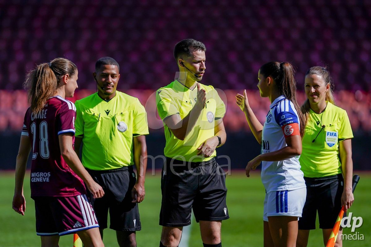 ZURICH, SWITZERLAND - September 6: Luna Lemperiere of GC Frauenfussball (R) and Referee Faruk Tutnjic (M) during the AXA Women's Super League match between GC Frauenfussball and Servette FC Chenois Feminin at Letzigrund on September 6, 2026 in Zurich, Switzerland.
