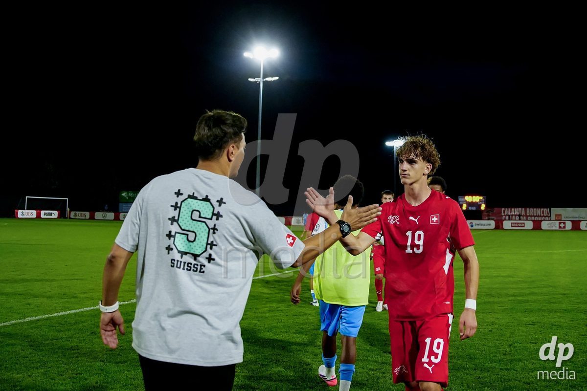 OBERE AU, Switzerland - September 8: Nevio Nyfeler of Switzerland (R) and Gabriele Francesco, Head Coach of Switzerland, (L) after the International Friendly U20 match between Switzerland and Luxembourg at TBD on September 8, 2026 in Obere Au, Switzerland.