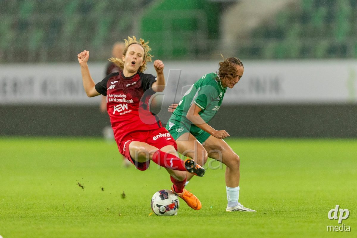 ST. GALLEN, SWITZERLAND - September 9: Yves Milva Heim of FC Aarau Frauen (L) battles for the ball with Monika Ibishaj of FC St. Gallen Frauen (R) during the AXA Women's Super League match between FC St. Gallen 1879 and FC Aarau Frauen at Berit Sitterstadion on September 9, 2026 in St. Gallen, Switzerland.