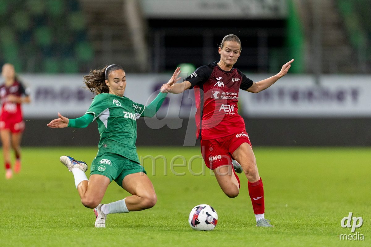 ST. GALLEN, SWITZERLAND - September 9: Olivia Edelmann of FC St. Gallen Frauen (L) fights for the ball with Xenia Truninger of FC Aarau Frauen (R) during the AXA Women's Super League match between FC St. Gallen 1879 and FC Aarau Frauen at Berit Sitterstadion on September 9, 2026 in St. Gallen, Switzerland.