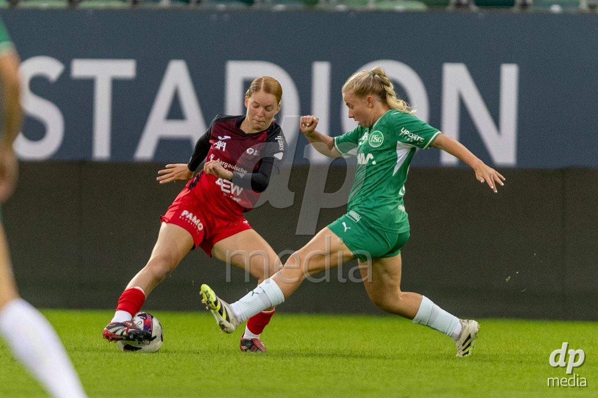 ST. GALLEN, SWITZERLAND - September 9: Yves Milva Heim of FC Aarau Frauen (L) battles for the ball with Monika Ibishaj of FC St. Gallen Frauen (R) during the AXA Women's Super League match between FC St. Gallen 1879 and FC Aarau Frauen at Berit Sitterstadion on September 9, 2026 in St. Gallen, Switzerland.