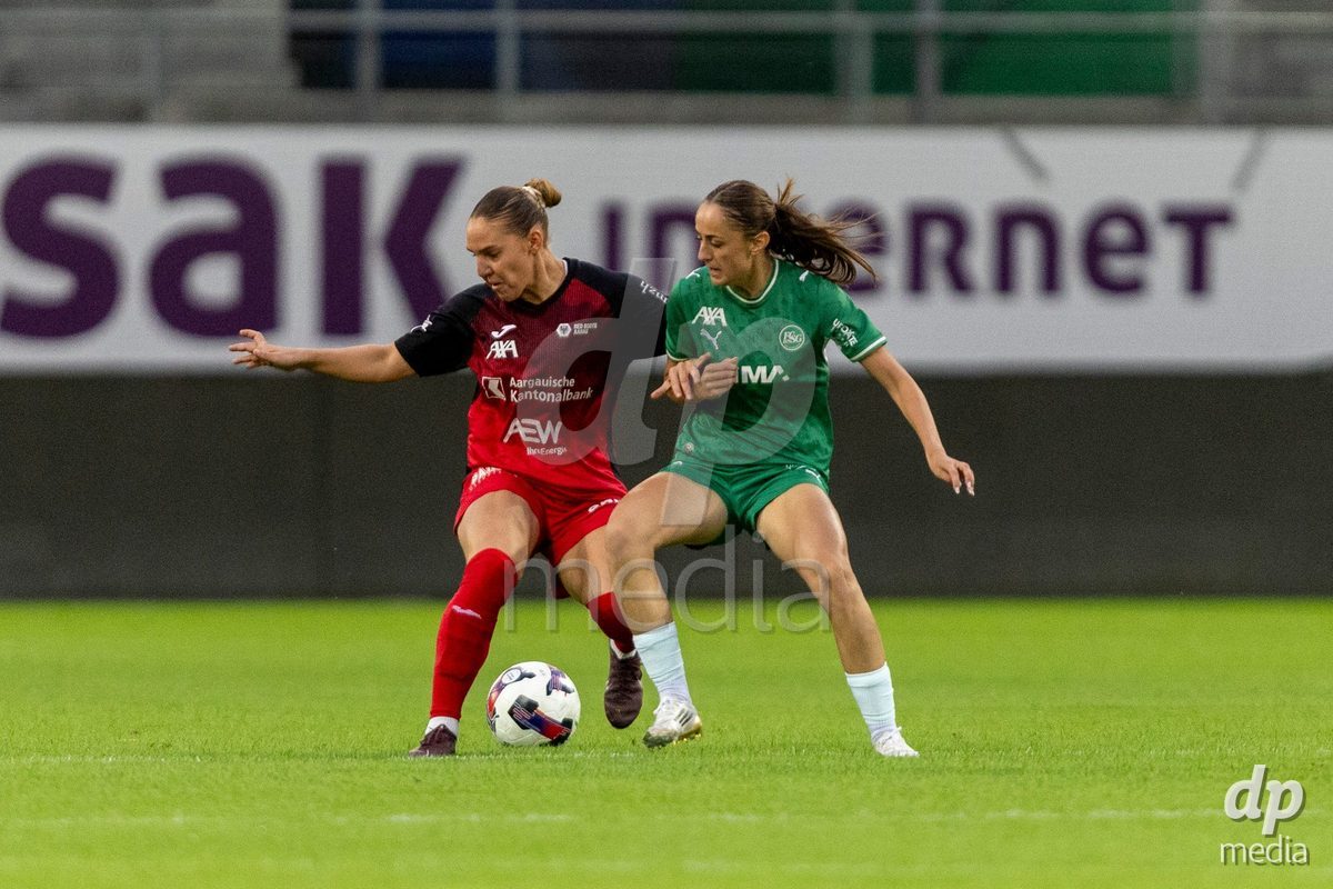 ST. GALLEN, SWITZERLAND - September 9: Yves Milva Heim of FC Aarau Frauen (L) battles for the ball with Monika Ibishaj of FC St. Gallen Frauen (R) during the AXA Women's Super League match between FC St. Gallen 1879 and FC Aarau Frauen at Berit Sitterstadion on September 9, 2026 in St. Gallen, Switzerland.