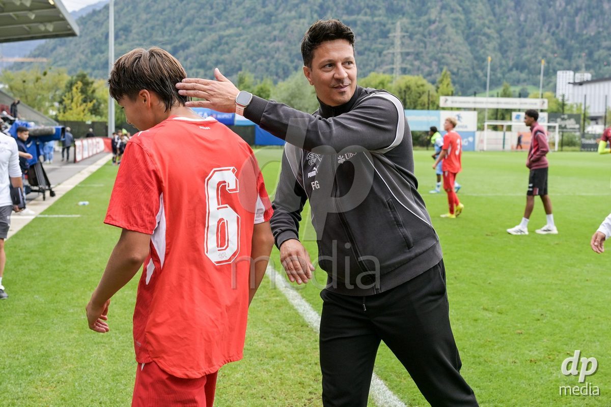 CHUR, SWITZERLAND - September 10: Francesco Gabriele, head coach of Switzerland U16, celebrates the performance with his players. of Switzerland celebrate the victory after the International friendly match between Switzerland U16 and Luxembourg U16 at Stade de Chur on September 10,2026 in Chur, Switzerland