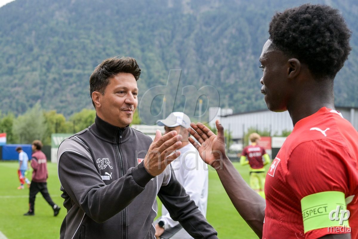 CHUR, SWITZERLAND - September 10: Francesco Gabriele, head coach of Switzerland U16, celebrates the performance with his players. of Switzerland celebrate the victory after the International friendly match between Switzerland U16 and Luxembourg U16 at Stade de Chur on September 10,2026 in Chur, Switzerland
