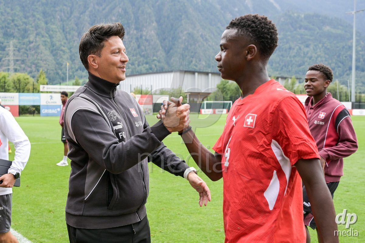 CHUR, SWITZERLAND - September 10: Francesco Gabriele, head coach of Switzerland U16, celebrates the performance with his players. of Switzerland celebrate the victory after the International friendly match between Switzerland U16 and Luxembourg U16 at Stade de Chur on September 10,2026 in Chur, Switzerland