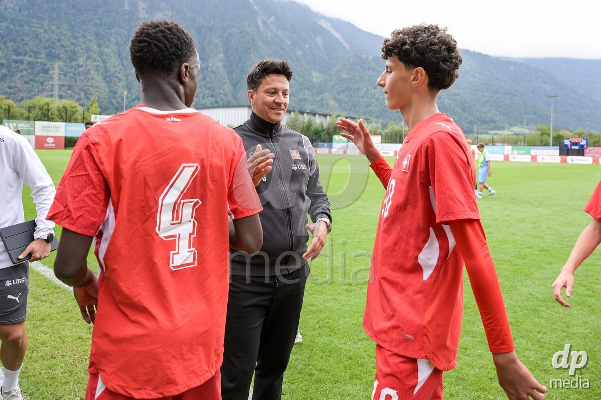 CHUR, SWITZERLAND - September 10: Francesco Gabriele, head coach of Switzerland U16, celebrates the performance with his players. of Switzerland celebrate the victory after the International friendly match between Switzerland U16 and Luxembourg U16 at Stade de Chur on September 10,2026 in Chur, Switzerland
