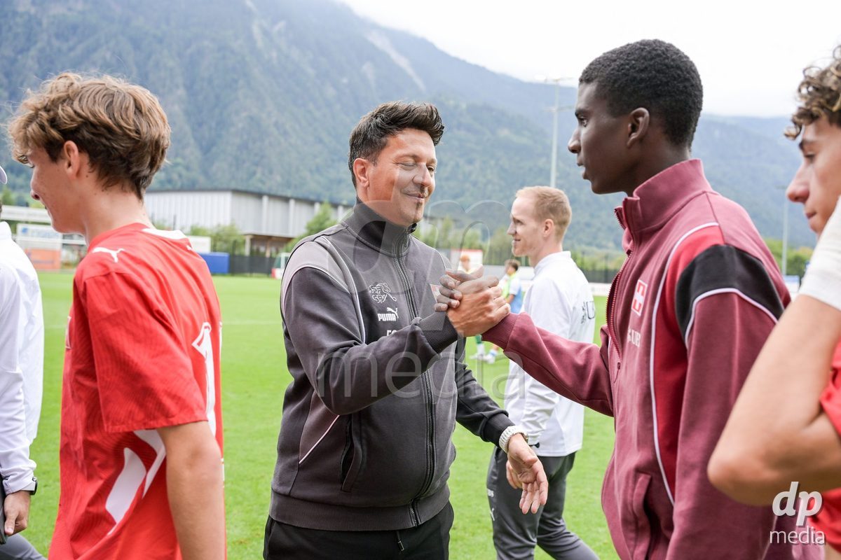 CHUR, SWITZERLAND - September 10: Francesco Gabriele, head coach of Switzerland U16, celebrates the performance with his players. of Switzerland celebrate the victory after the International friendly match between Switzerland U16 and Luxembourg U16 at Stade de Chur on September 10,2026 in Chur, Switzerland