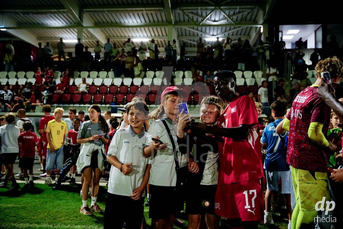 OBERE AU, Switzerland - September 8: Jessy Madox Kongenda of Switzerland with fans after the International Friendly U20 match between Switzerland and Luxembourg at TBD on September 8, 2026 in Obere Au, Switzerland.