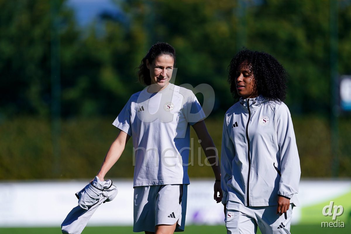 Rapperswil, Switzerland - September 12: Mickaella Cardia (Mickaëlla Cardia) of Servette FC Chenois Feminin (R) and Noemie Carage (Noémie Carage) of Servette FC Chenois Feminin (L) arrival during the AXA Women's Super League match between FC Rapperswil-Jona and Servette FC Chenois Feminin at Stadion Grünfeld on September 12, 2026 in Rapperswil, Switzerland.