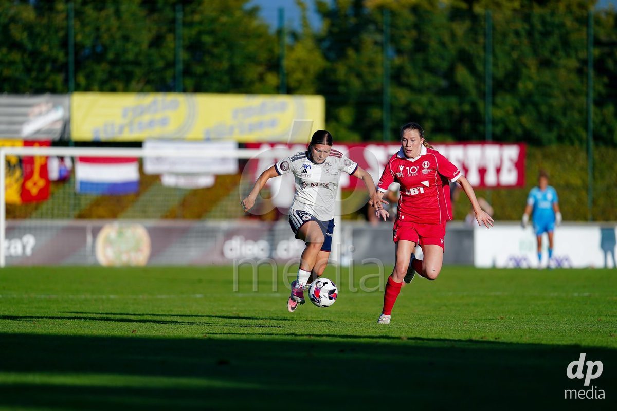 Rapperswil, Switzerland - September 12: Leyla Mcfarland of FC Rapperswil-Jona (R) and Chiara Wallin of Servette FC Chenois Feminin (L) battle for the ball during the AXA Women's Super League match between FC Rapperswil-Jona and Servette FC Chenois Feminin at Stadion Grünfeld on September 12, 2026 in Rapperswil, Switzerland.