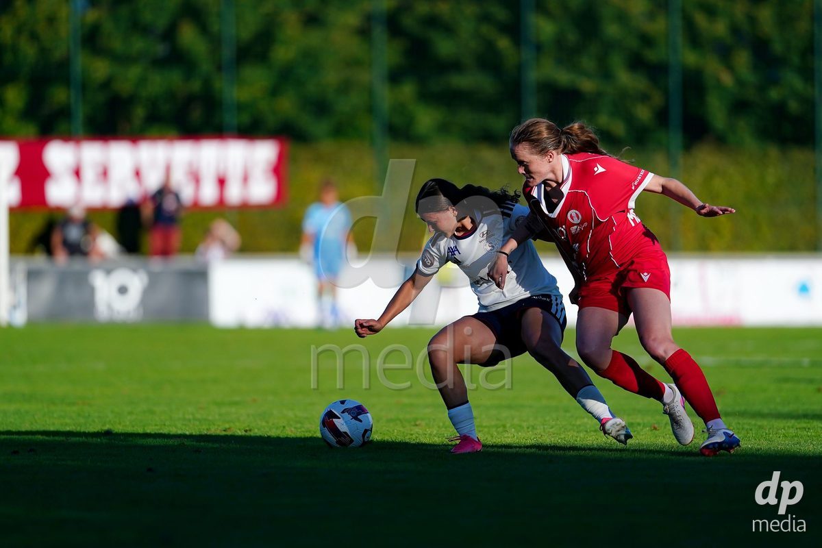 Rapperswil, Switzerland - September 12: Leyla Mcfarland of FC Rapperswil-Jona (R) and Chiara Wallin of Servette FC Chenois Feminin (L) battle for the ball during the AXA Women's Super League match between FC Rapperswil-Jona and Servette FC Chenois Feminin at Stadion Grünfeld on September 12, 2026 in Rapperswil, Switzerland.
