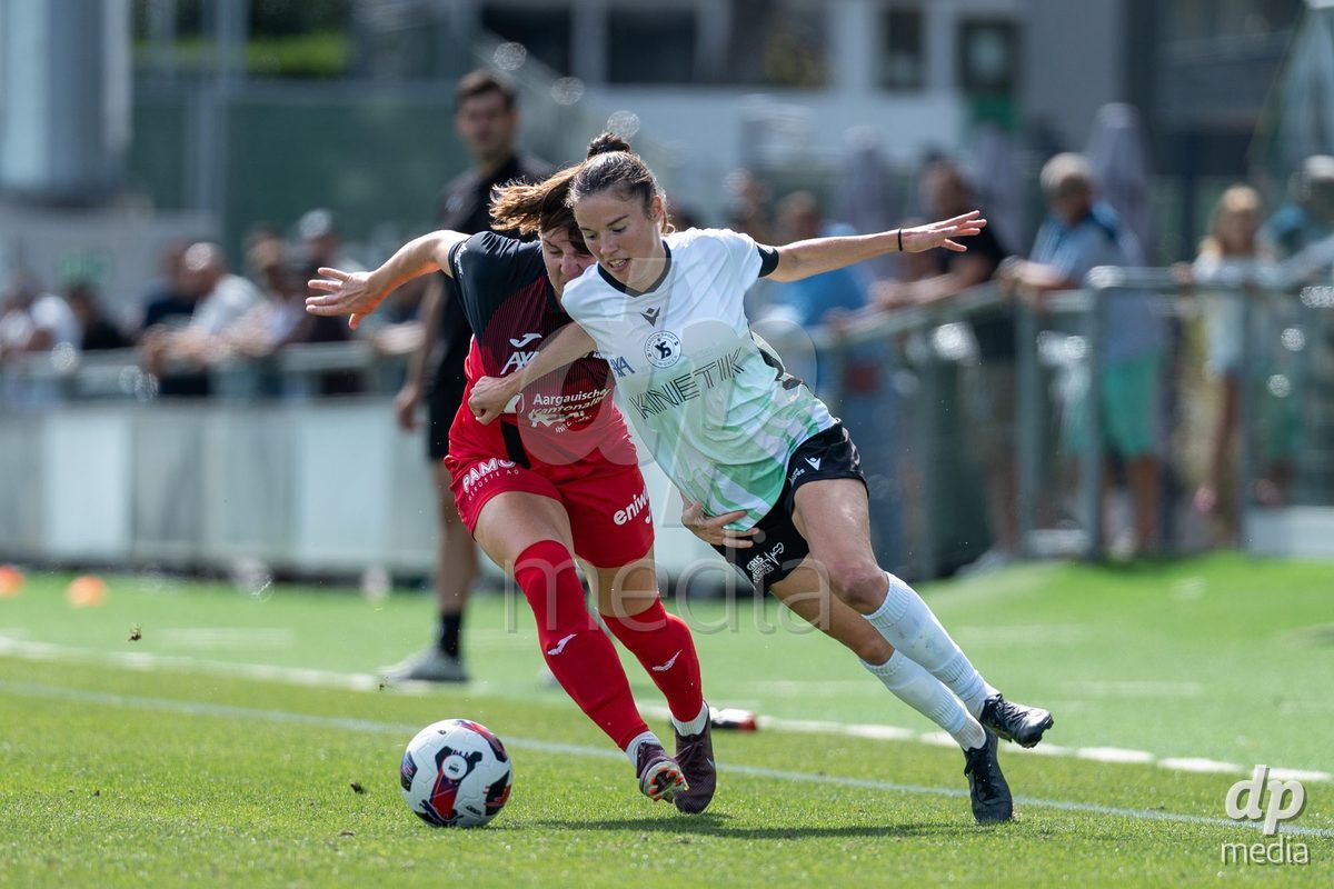 YVERDON-LES-BAINS - SWITZERLAND - SEPTEMBER 13 : Duel between Chloé Marie Anne Le Franc of Yverdon Sport Women and Rebecca Anne Storr of FC Aarau Frauen during the AXA Women's Super League match between Yverdon Sport Women and FC Aarau Frauen at Stade Municipal on September 13, 2026 in Yverdon-les-Bains, Switzerland.