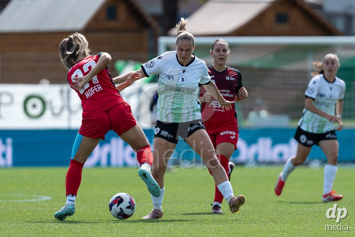 YVERDON-LES-BAINS - SWITZERLAND - SEPTEMBER 13 : Celia Hofer of FC Aarau Frauen defends against Emeline von Dach of Yverdon Sport Women during the AXA Women's Super League match between Yverdon Sport Women and FC Aarau Frauen at Stade Municipal on September 13, 2026 in Yverdon-les-Bains, Switzerland.