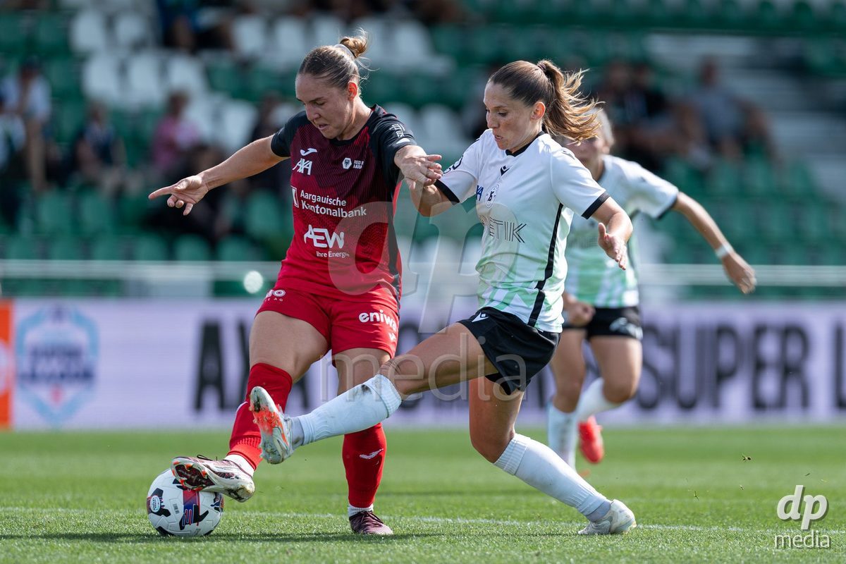 YVERDON-LES-BAINS - SWITZERLAND - SEPTEMBER 13 : Duel between Sandrine Gaillard Mauron of Yverdon Sport Women and Rebecca Anne Storr of FC Aarau Frauen during the AXA Women's Super League match between Yverdon Sport Women and FC Aarau Frauen at Stade Municipal on September 13, 2026 in Yverdon-les-Bains, Switzerland.