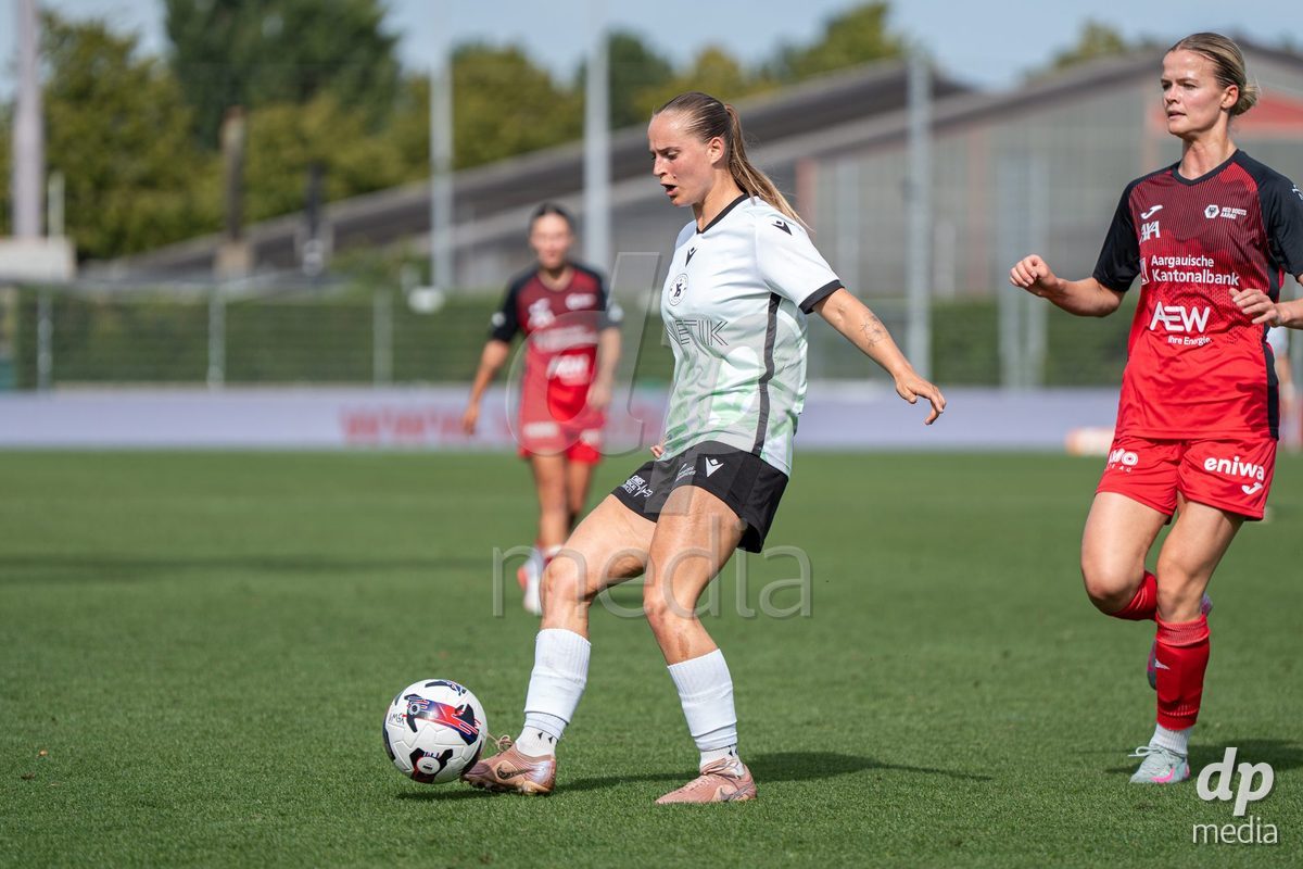 YVERDON-LES-BAINS - SWITZERLAND - SEPTEMBER 13 : Emeline von Dach of Yverdon Sport Women passes the ball during the AXA Women's Super League match between Yverdon Sport Women and FC Aarau Frauen at Stade Municipal on September 13, 2026 in Yverdon-les-Bains, Switzerland.