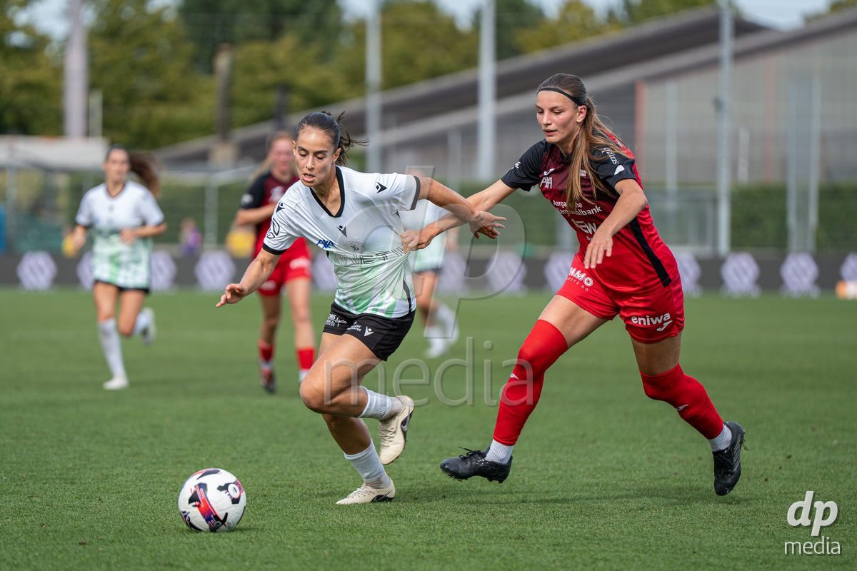 YVERDON-LES-BAINS - SWITZERLAND - SEPTEMBER 13 : Duel between Ines Khiri of Yverdon Sport Women and Celia Hofer of FC Aarau Frauen during the AXA Women's Super League match between Yverdon Sport Women and FC Aarau Frauen at Stade Municipal on September 13, 2026 in Yverdon-les-Bains, Switzerland.