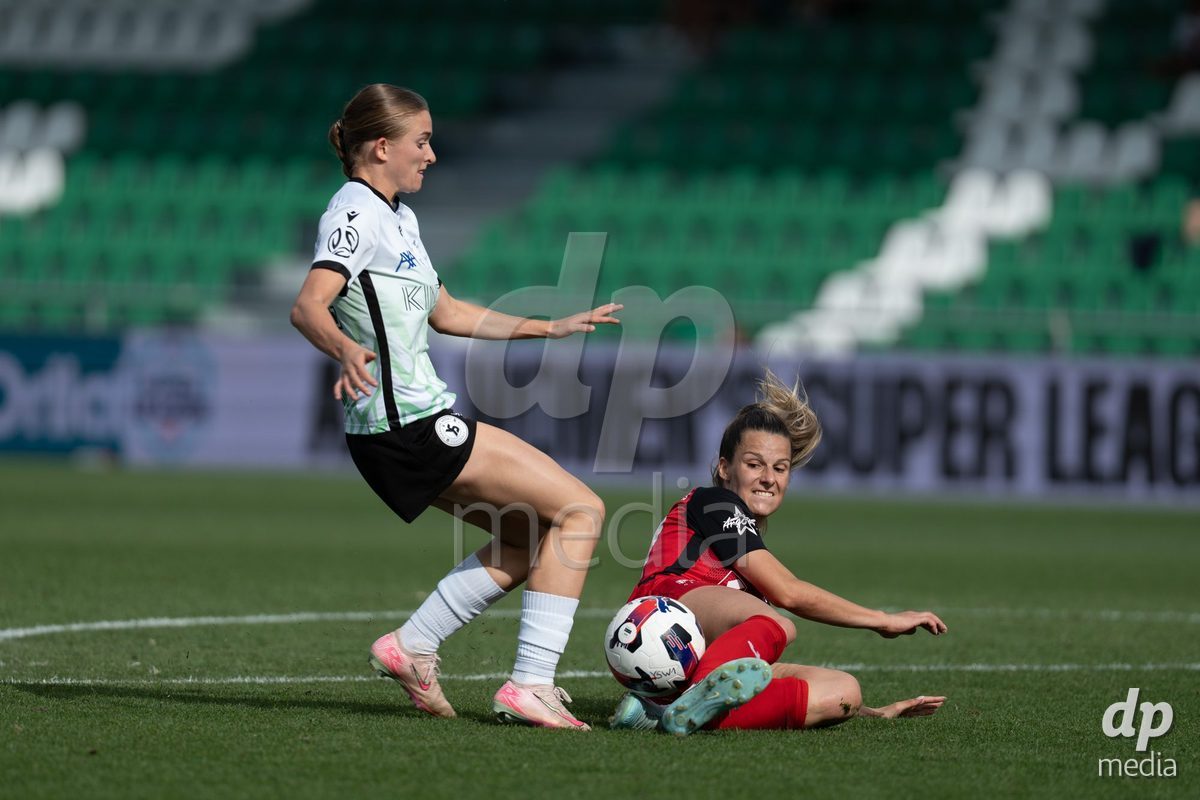 YVERDON-LES-BAINS - SWITZERLAND - SEPTEMBER 13 : Celia Hofer of FC Aarau Frauen makes a tackle on Maëlle Savoie Poitras of Yverdon Sport Women during the AXA Women's Super League match between Yverdon Sport Women and FC Aarau Frauen at Stade Municipal on September 13, 2026 in Yverdon-les-Bains, Switzerland.