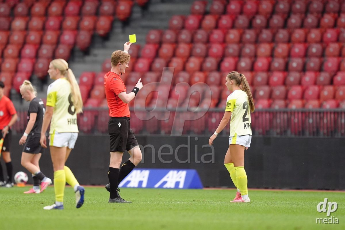 Zurich, Switzerland - September 13: Referee Samuel Gubic with yellow card to Alisa Renee Arthur of FC Basel 1893 during the AXA Women's Super League match between FC Zurich and FC Basel 1893 at Stadion Letzigrund on September 13, 2026 in Zurich, Switzerland.