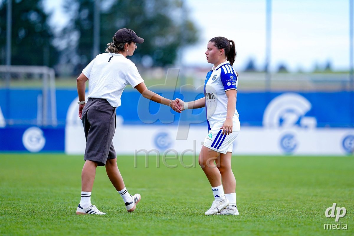 NIEDERHASLI, SWITZERLAND - September 13: Michelle Storni of GC Frauenfussball (R) and Laura Vetterlein, Head Coach of GC Frauenfussball, (L) after the AXA Women's Super League match between GC Frauenfussball and FC Luzern at GC Campus on September 13, 2026 in Niederhasli, Switzerland.