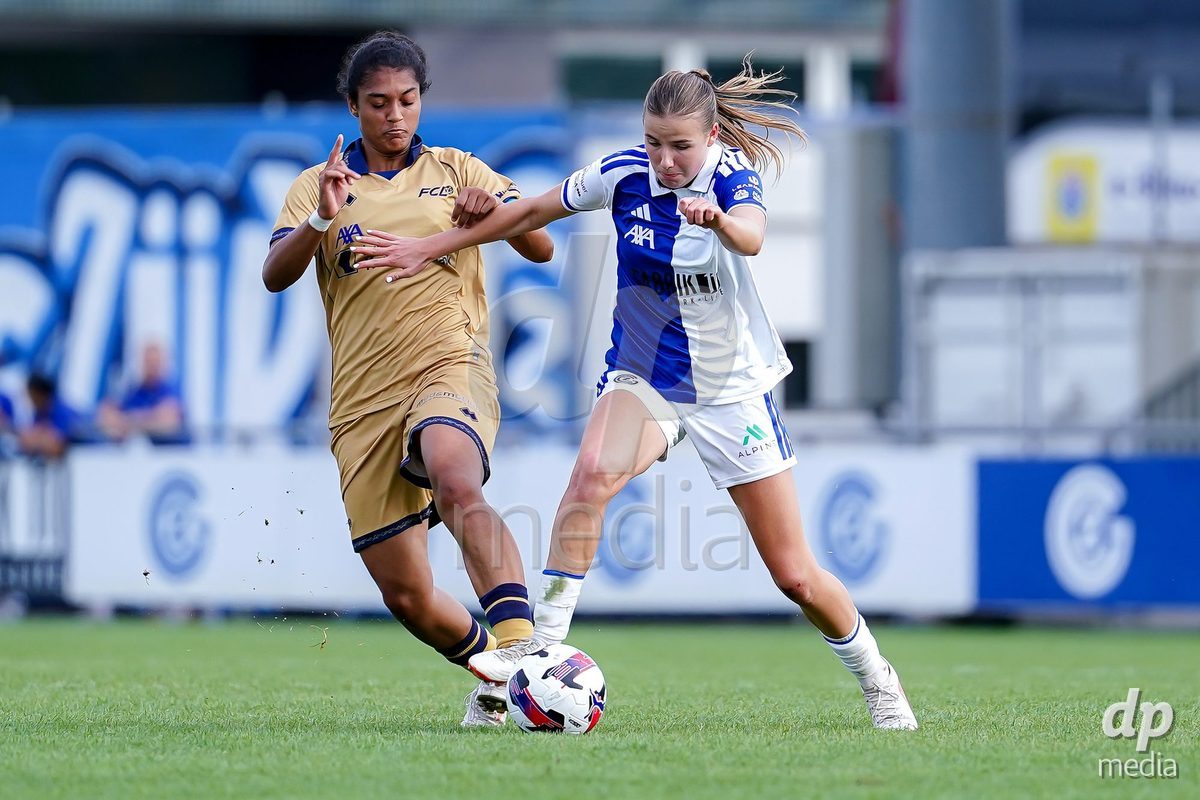NIEDERHASLI, SWITZERLAND - September 13: Giulia Looser of GC Frauenfussball (R) and Aldiana Amuchie of FC Luzern (L) battle for the ball during the AXA Women's Super League match between GC Frauenfussball and FC Luzern at GC Campus on September 13, 2026 in Niederhasli, Switzerland.