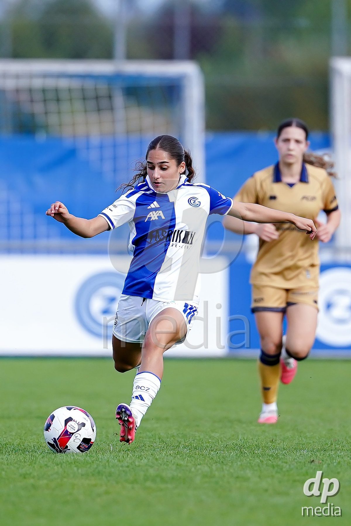 NIEDERHASLI, SWITZERLAND - September 13: Ilaria Maddaloni of GC Frauenfussball controls the ball during the AXA Women's Super League match between GC Frauenfussball and FC Luzern at GC Campus on September 13, 2026 in Niederhasli, Switzerland.