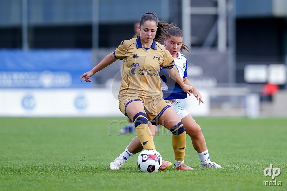 NIEDERHASLI, SWITZERLAND - September 13: Michelle Storni of GC Frauenfussball (R) and Melissa Rondalli of FC Luzern (L) battle for the ball during the AXA Women's Super League match between GC Frauenfussball and FC Luzern at GC Campus on September 13, 2026 in Niederhasli, Switzerland.