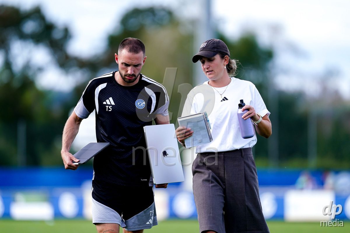 NIEDERHASLI, SWITZERLAND - September 13: Laura Vetterlein, Head Coach of GC Frauenfussball, (R) and Thiago Semadeni of GC Frauenfussball (L) during the AXA Women's Super League match between GC Frauenfussball and FC Luzern at GC Campus on September 13, 2026 in Niederhasli, Switzerland.