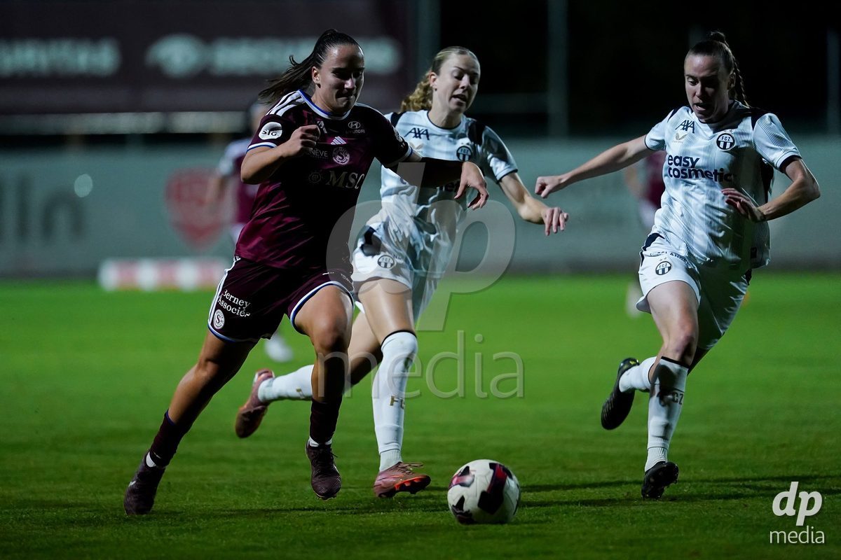 GENEVA, SWITZERLAND - SEPTEMBER 18: Claire O'Riordan of FC Zurich (R), Briana Eads of FC Zurich (M), and Magdalena Sobal of Servette FC Chenois Feminin (L) battle for the ball during the AXA Women's Super League match between Servette FC Chenois Feminin and FC Zurich at Stade de Trois-Chene on September 18, 2026 in Geneva, Switzerland.