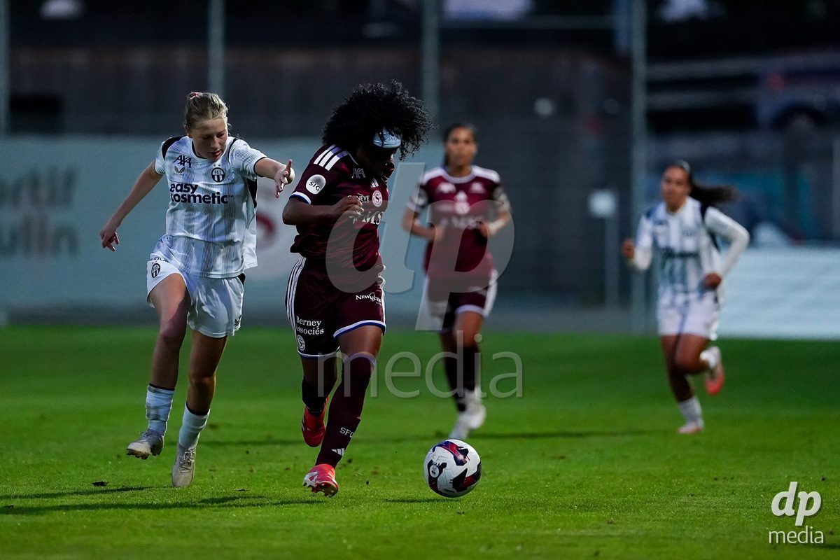 GENEVA, SWITZERLAND - SEPTEMBER 18: Mickaella Cardia (Mickaëlla Cardia) of Servette FC Chenois Feminin (R) and Marlene Wild of FC Zurich (L) battle for the ball during the AXA Women's Super League match between Servette FC Chenois Feminin and FC Zurich at Stade de Trois-Chene on September 18, 2026 in Geneva, Switzerland.