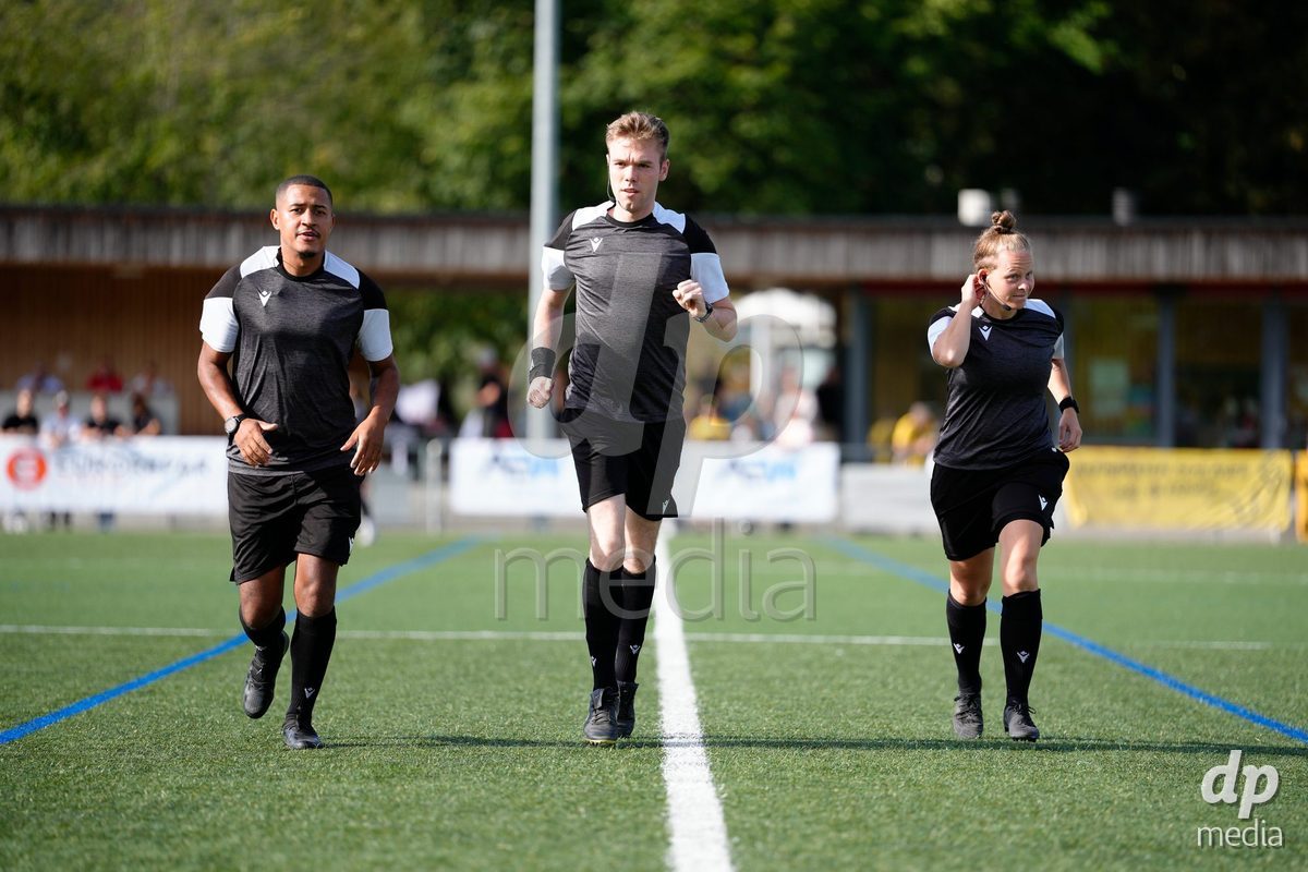 AARAU, SWITZERLAND - SEPTEMBER 19: Referee Jonas Rosenthaler (Center), Assistant Referee 1 Luana Sortino (Right) and Assistant Referee 2 Roland Muller (Left) during warmup before the AXA Women's Super League match between FC Aarau Frauen and BSC YB Frauen at Sportanlage Schachen on September 19, 2026 in Aarau, Switzerland.